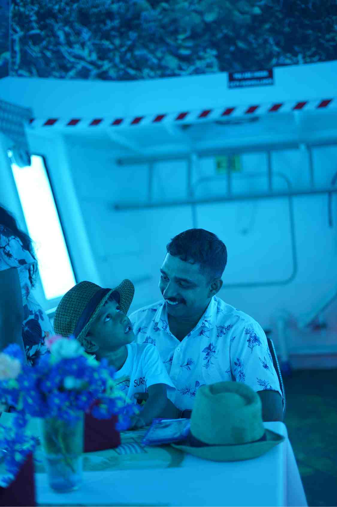 A father and child enjoying the underwater viewing deck