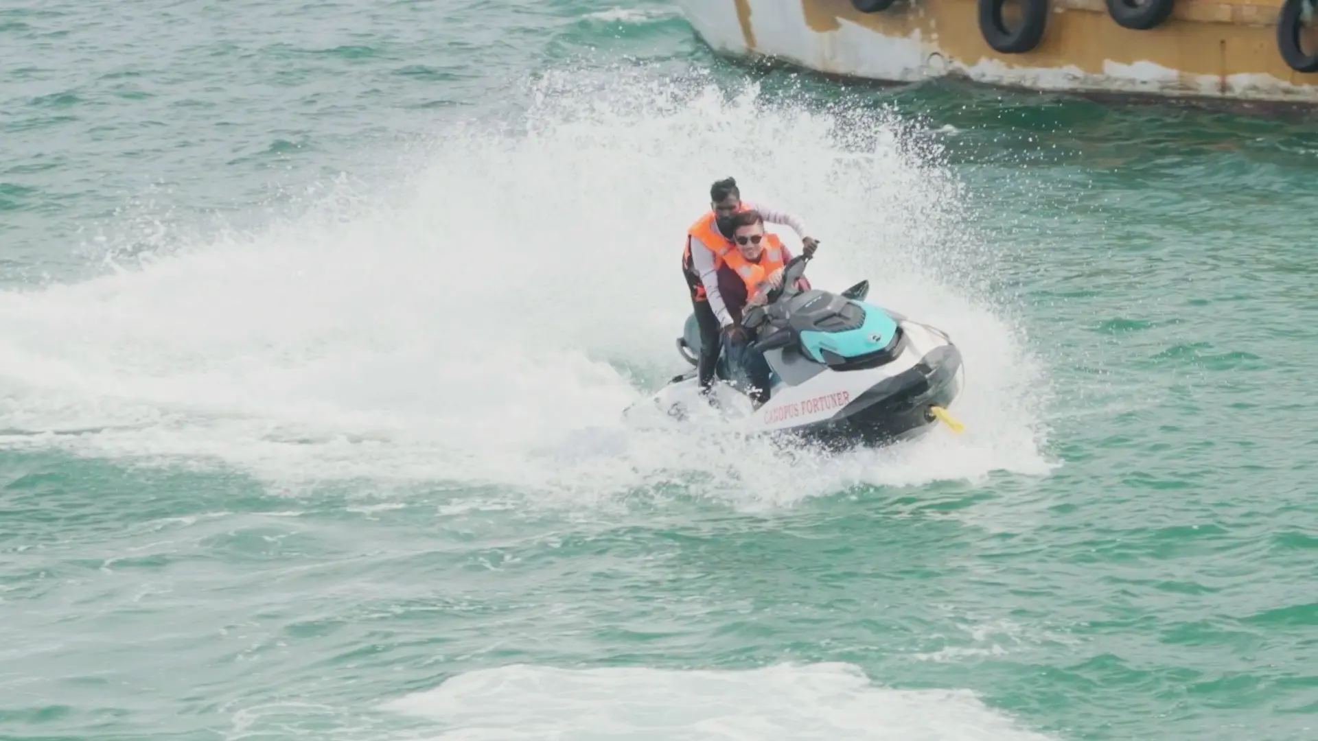 Guests splashing through the waves on a jet ski ride