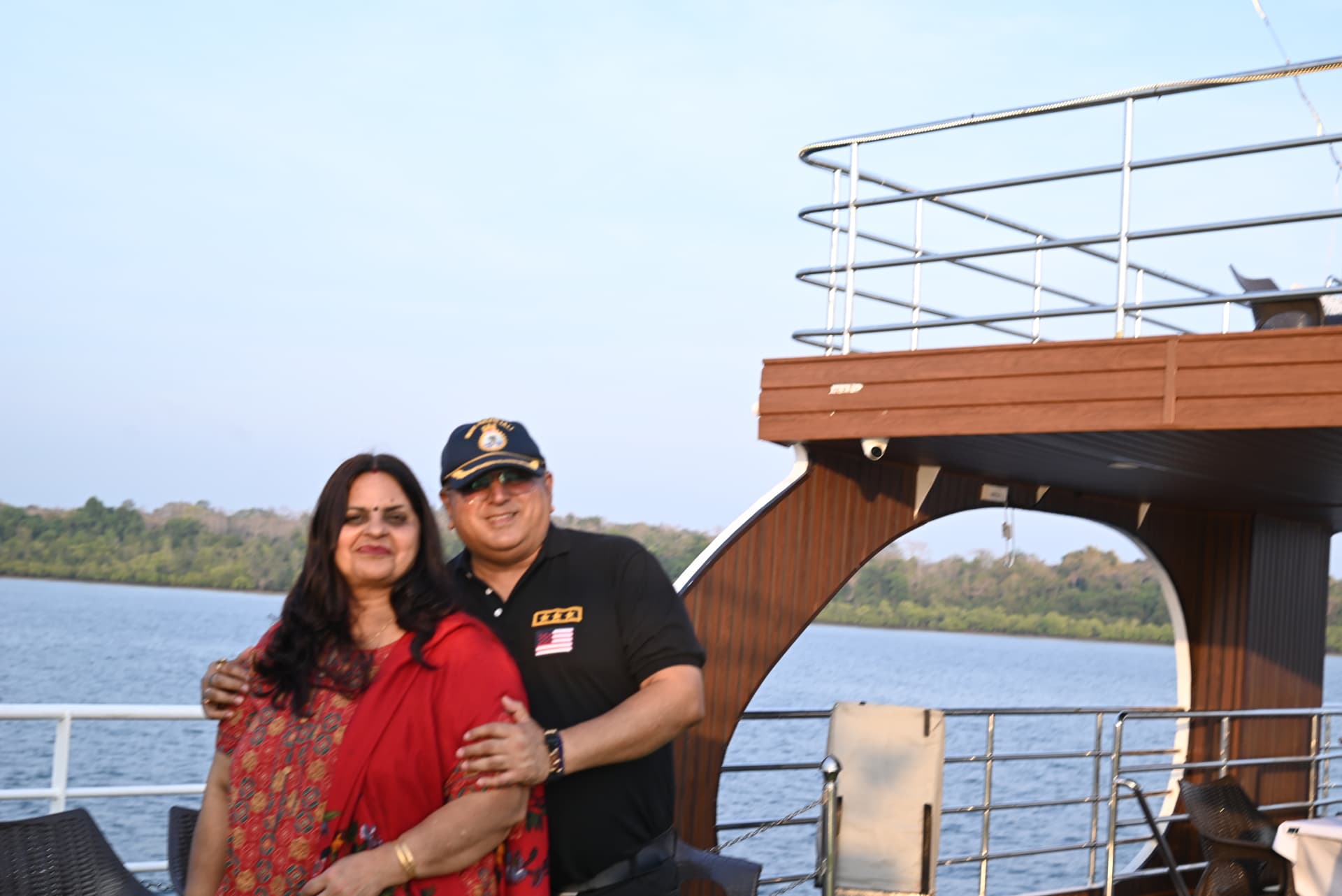 A couple enjoying the evening on board with the semi-submarine behind
