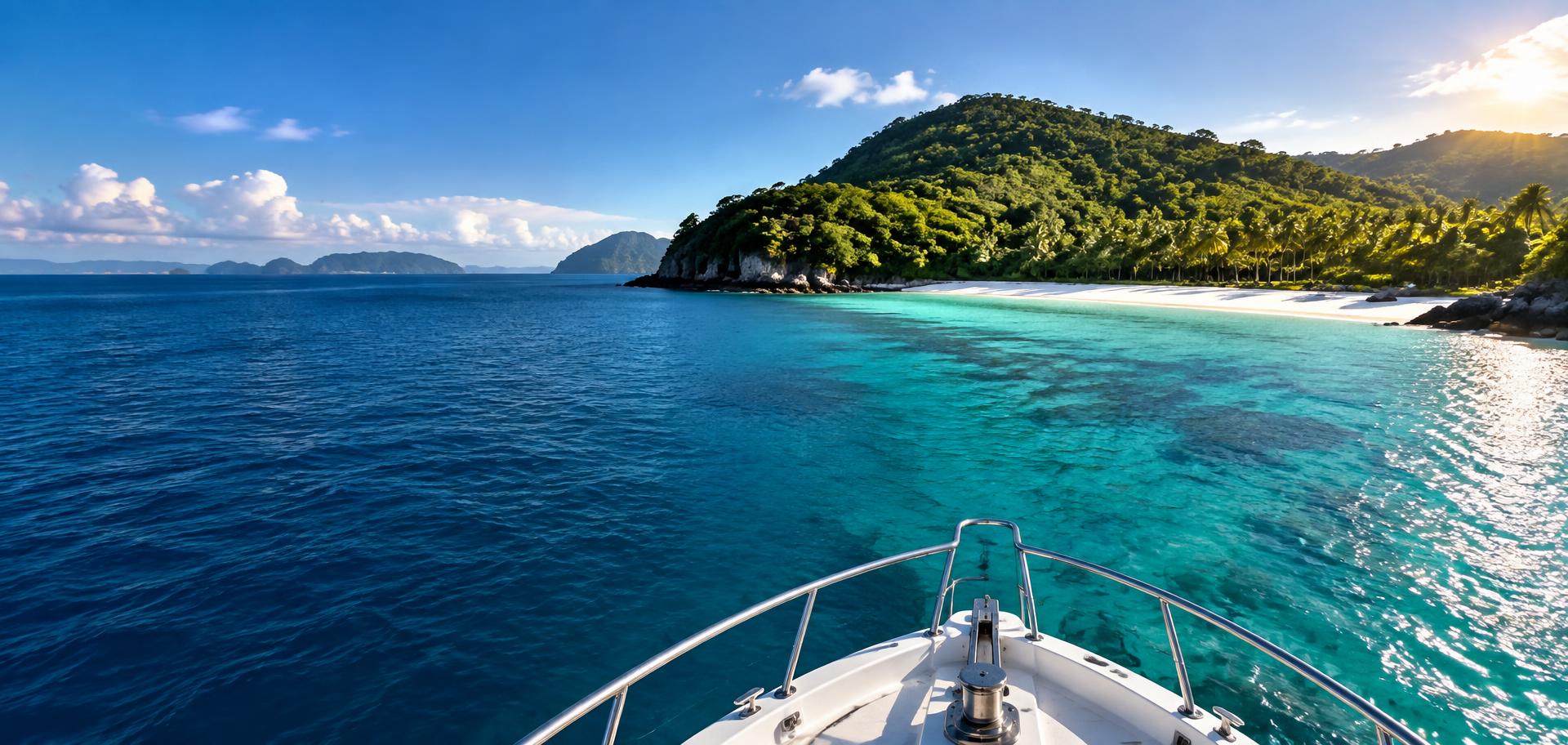 View from a boat approaching a lush tropical island and white-sand beach across turquoise Andaman waters
